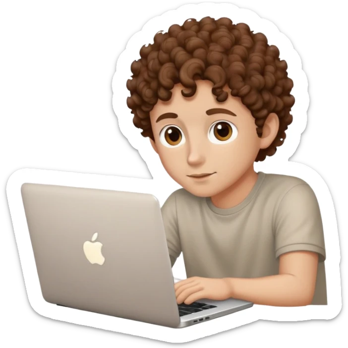 male with brown eyes and very short brown curly hair with a fade, sitting behind an Apple laptop sticker
