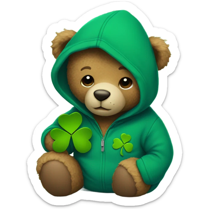 
A teddy bear wears a blue hoodie and holds a shamrock sticker
