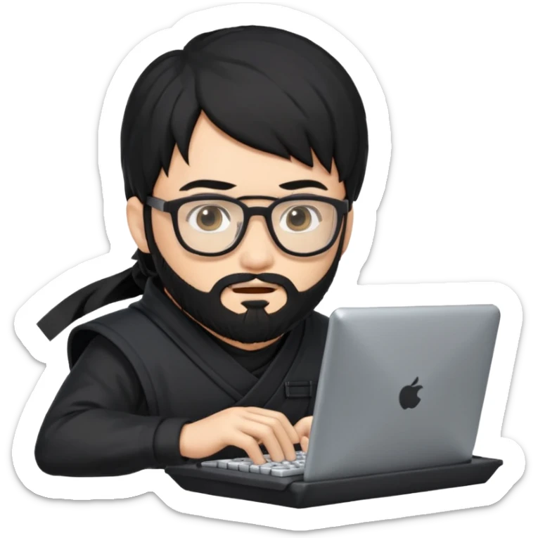 Man with black hair and beard wearing glasses in a ninja costume typing on a computer keyboard sticker