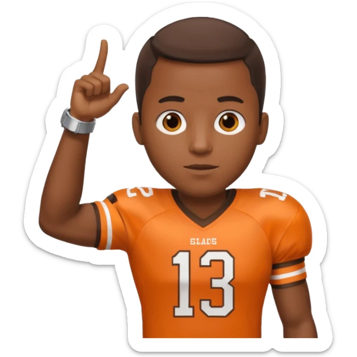 Black man in a brown and orange football jersey holding up his left arm with a watch on, pointing at the watch with his right hand sticker