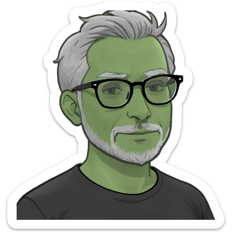Indian man with grey hair,grey glasses, small beard and black t-shirt sticker