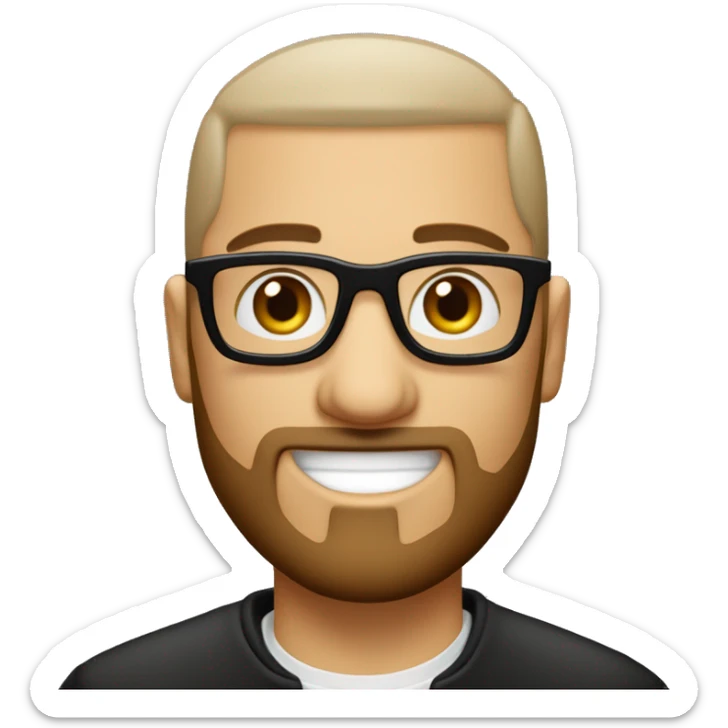 Un homme blanc avec une barbe noir rasé et des cheveux noir en buzz cut avec des yeux marron et des lunette fine et ronde qui travail sur un macbook sticker