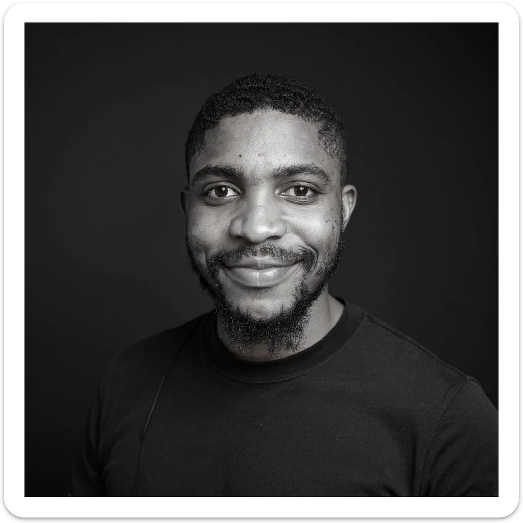 A professional portrait of me in monochrome. Plain black crew neck shirt. Tailored to LinkedIn. Tech boy vibe (programmer). I’m a black man from Nigeria. Retain facial features from attached image. sticker