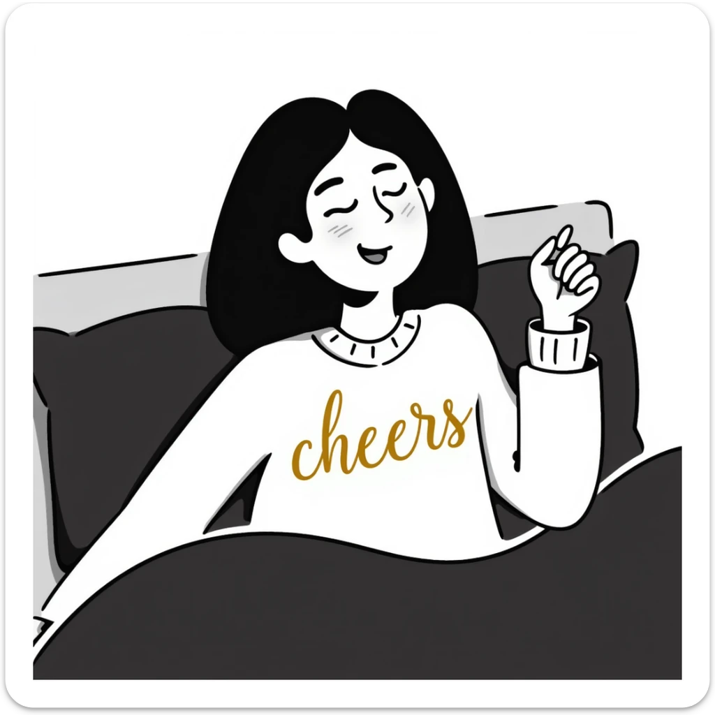 A woman with shoulder-length black hair, light to medium skin tone, full cheeks, and almond-shaped eyes, wearing a white sweater with the word 'cheers' in gold script, lying comfortably on a bed with soft lighting, joyful and radiant expression sticker