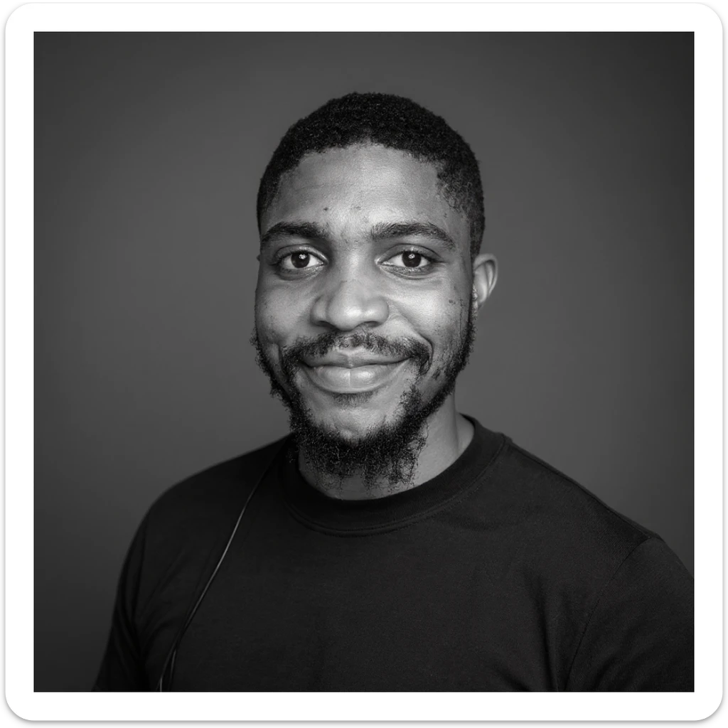 A professional portrait of me in monochrome. Plain black crew neck shirt. Tailored to LinkedIn. Tech boy vibe (programmer). I’m a black man from Nigeria. Retain facial features from attached image. Smooth skin. No accessories. sticker