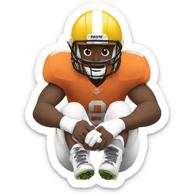 football player sitting down holding his knee sticker