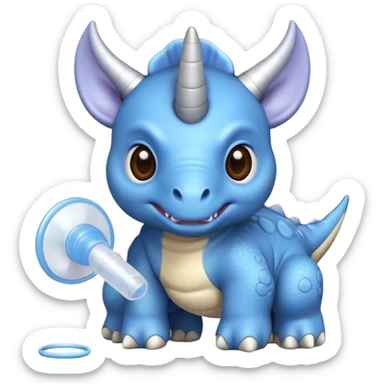 A small blue baby triceratops toy with stubby horns and a pacifier sticker
