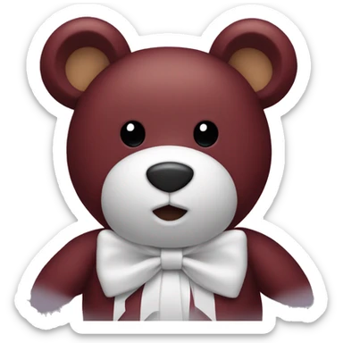 a burgundy teddy bear with a white bow sticker
