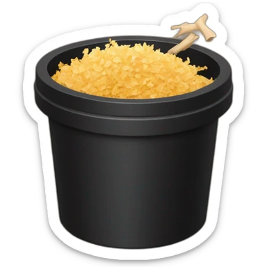 Black cubic plastic container with wood shavings inside, and a white tube with three branches at the top  sticker