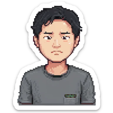 Asian man in a gray shirt with a frown sticker