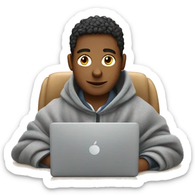 male student sitting at a school desk with a big blanket wrapped around shoulders working on chromebook sticker