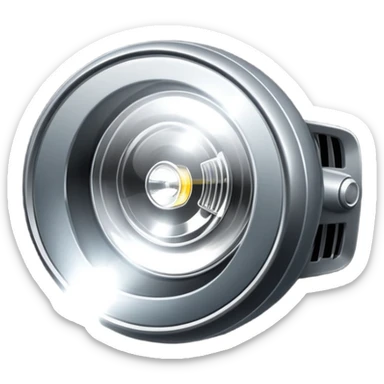 A car headlight, shining brightly with a focused beam of light, cutting through the dark, illuminating the road ahead. The light is intense and clear, often with a white or yellowish glow sticker