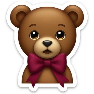 a burgundy teddy bear with a bow sticker