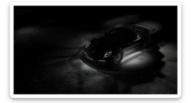 Editorial shot of a porsche 911 gt3 rs, top dutch angle, black voide around, top spotlight, captured on arri alexa sticker
