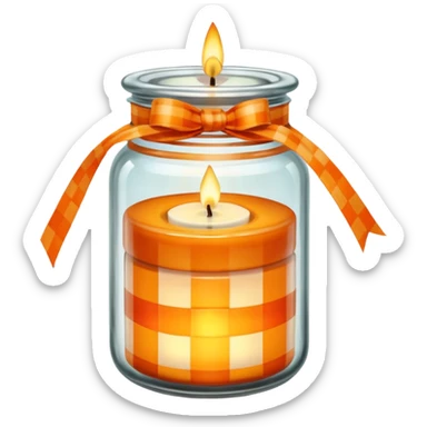 Glass jar with a candle in it and an orange checkered ribbon sticker