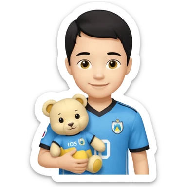 Un enfant qui a les cheveux noir sur le coter qui sourit il a un maillot de l’om et qui a un petit doudou jaune sur son epaule sticker