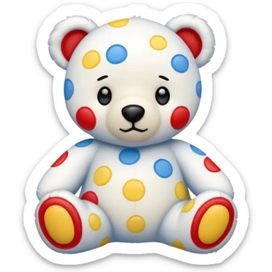 White teddy bear covered with blue, red and yellow spots sticker