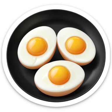 Two boil eggs in a black plate cut in half sticker
