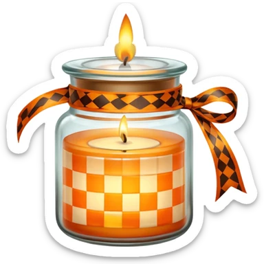 Glass jar with a candle in it and an orange checkered ribbon sticker