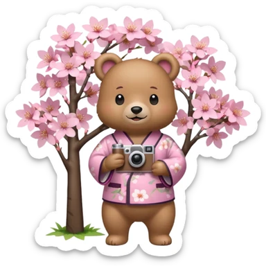 A cute light-brown bear wearing a pastel pink sakura-patterned kimono, normal balanced body ratio.  
Standing under a blooming sakura tree, holding a small camera and taking a picture with a happy smile.  
Kawaii emoji style, minimalistic clean sticker illustration, simple scenic background.
 sticker