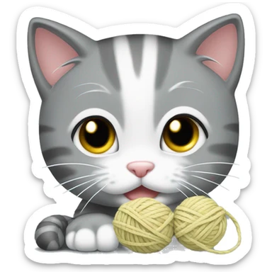 gray kitten with white muzzle plays with a ball of yarn sticker