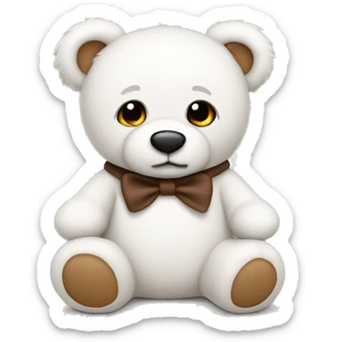 White teddy bear with brown sticker