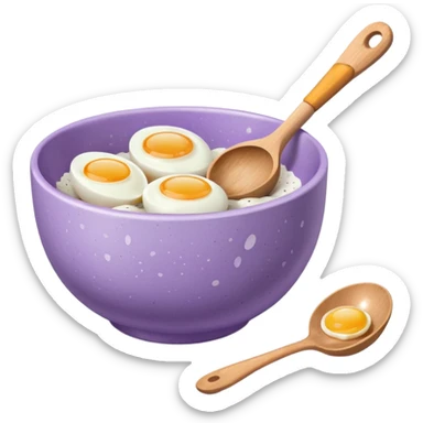 a lilac ceramic mixing bowl with a wooden spoon stirring and sitting next to it is a few eggs sticker