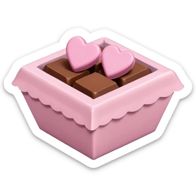 Two square milk chocolate , Each praline is a sharp-edged cube with smooth glossy chocolate coating, placed in a small white fluted paper candy cup. On top of each cube is a flat pastel pink heart-shaped icing sticker