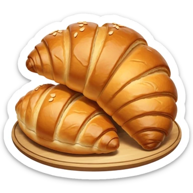 meat.A group of baked goods: a round bread roll beside a small croissant on a warm golden background. sticker