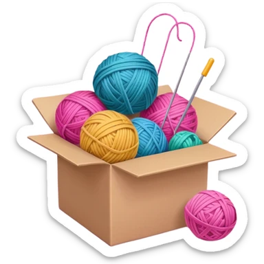 paper box with toys, ball of yarn, pink sticker