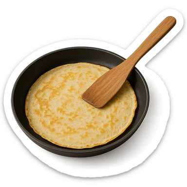 a French crepe being cooked in a pan, with a wooden spatula sticker