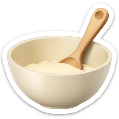 A cream ceramic baking bowl with a wooden spoon in it sticker