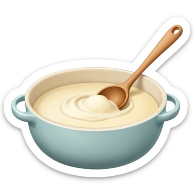 A cream ceramic baking bowl with a wooden spoon in it sticker