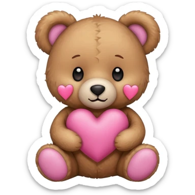 Teddy bear holding a pink heart sticker