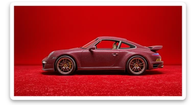 Medium shot of a porsche 911 made of carpet, red solid studio background, top soft light sticker