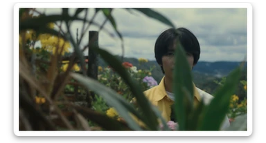 A portrait of a person in the foreground, blurred plants in the foreground (close to the camera), a wooden fence and colorfull flowers in the midground, rolling hills in the background, cinematic depth of field, layered composition, natural lighting sticker