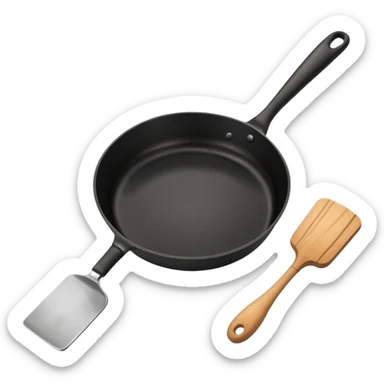 a black pan and spatula inside sticker