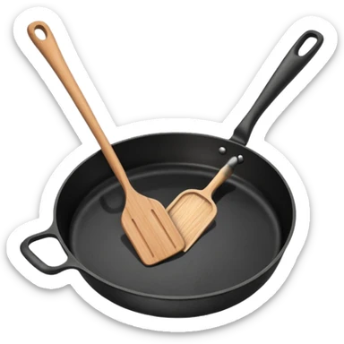 a black pan and spatula inside sticker