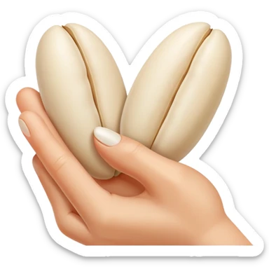 Two fingers pinching a white bean sticker