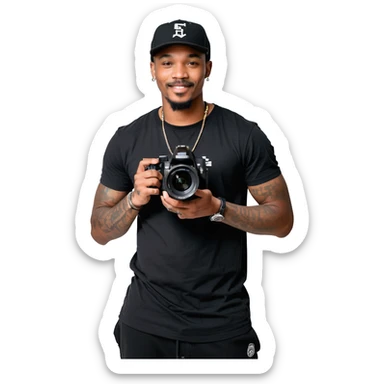 A young, black, South African, male cinematographer dressed in a black round neck t-shirt, black pants and black baseball cap holding a mirrorless dslr camera in one hand. Dark brown eyes. Bright white smile. Minimal facial hair — a small moustache connected to a goatee. Arms covered in tattoos. sticker