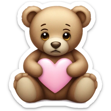 Teddy bear with sad eyes holding a pastel pink heart sticker