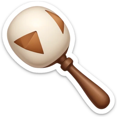 White rattle with triangles drawn on it in brown sticker
