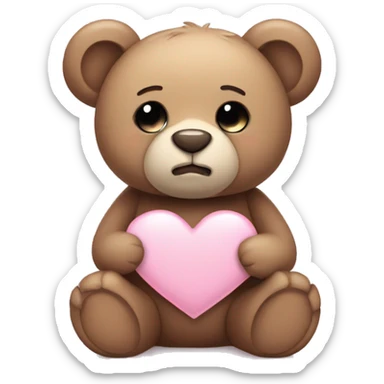 Teddy bear with sad eyes holding a pastel pink heart sticker