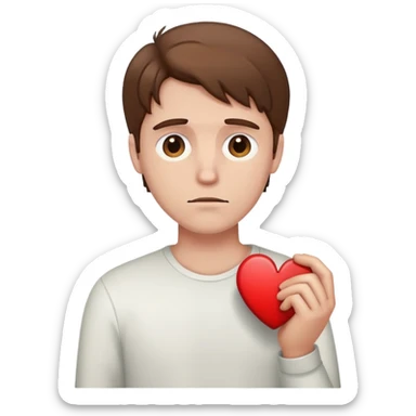 White man with brown hair holding a broken heart sticker