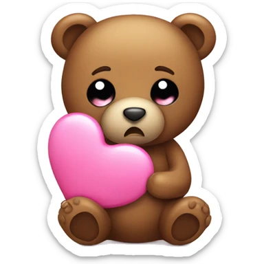 Teddy bear with sad eyes holding a pink heart sticker