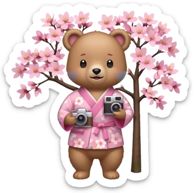 A cute light-brown bear wearing a pastel pink sakura-patterned kimono, normal balanced body ratio.  
Standing under a blooming sakura tree, holding a small camera and taking a picture with a happy smile.  
Kawaii emoji style, minimalistic clean sticker illustration, simple scenic background.
 sticker