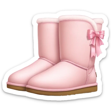 a pair of light pink ugg boots with ribbon sticker