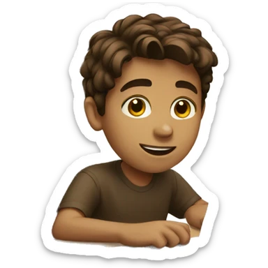 Brown haired boy at desk with a laptop sticker