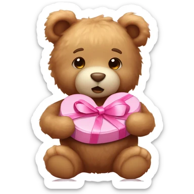 Light brown fluffy teddy bear holding a box of pink heart chocolates and has a bow on its head that’s light pink  sticker