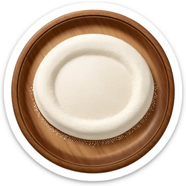 spinkles of flour on circular wooden slightly curved plate sticker